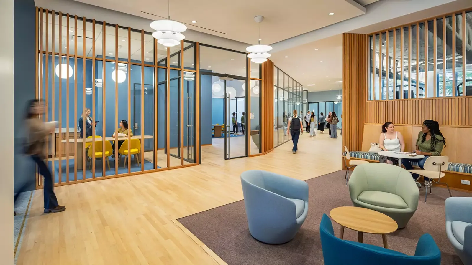 Lobby of the Francine LeFrak Center, an airy room with light-green and blue seating